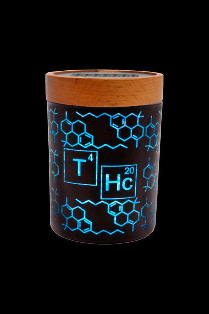 A black cylindrical container with a wood-grain lid, featuring a glowing blue periodic table-style design displaying “THC” and molecular structures.