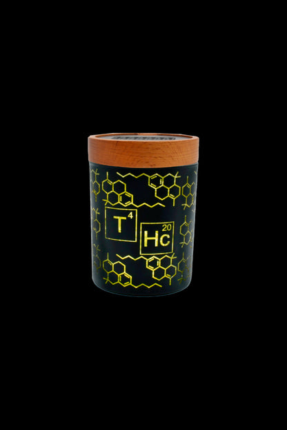 Green glass smoking piece with THC molecular structure design and wooden top.