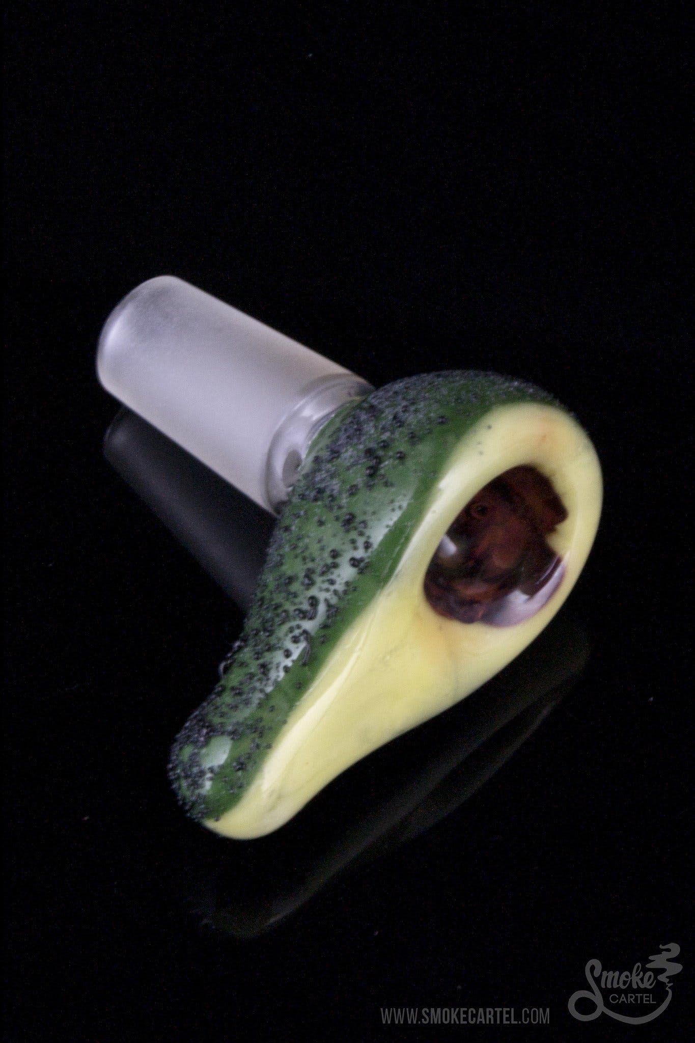 A close-up, angled view of the Empire Glassworks "Avocadope" Flower Bowl, showcasing its green and textured glass design.