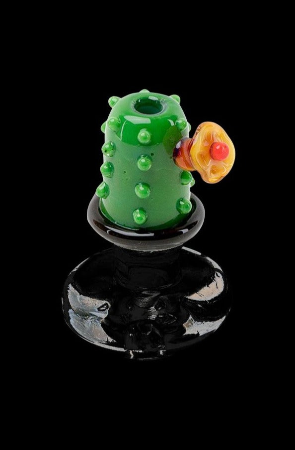A close-up, angled view of the Empire Glassworks "Barrel Cactus" carb cap, showcasing its green, textured design.