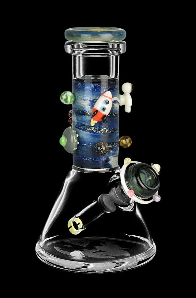 Front view of the Empire Glassworks Baby Beaker Water Pipe - Galaxy, showing a clear glass beaker with swirling blue and purple galaxy patterns.