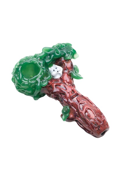 The Empire Glassworks "Squirrels Nest" Spoon Pipe is shown in a close-up, angled view, featuring a textured, green and brown design resembling a nest.