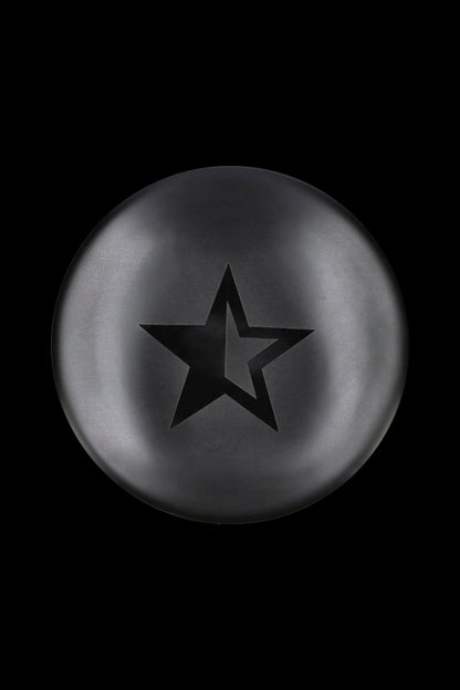Black star-shaped silicone cap for cannabis concentrates.
