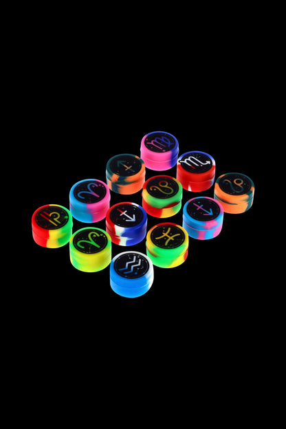 Colorful silicone caps with zodiac signs arranged in a pyramid shape, likely for use with cannabis accessories.