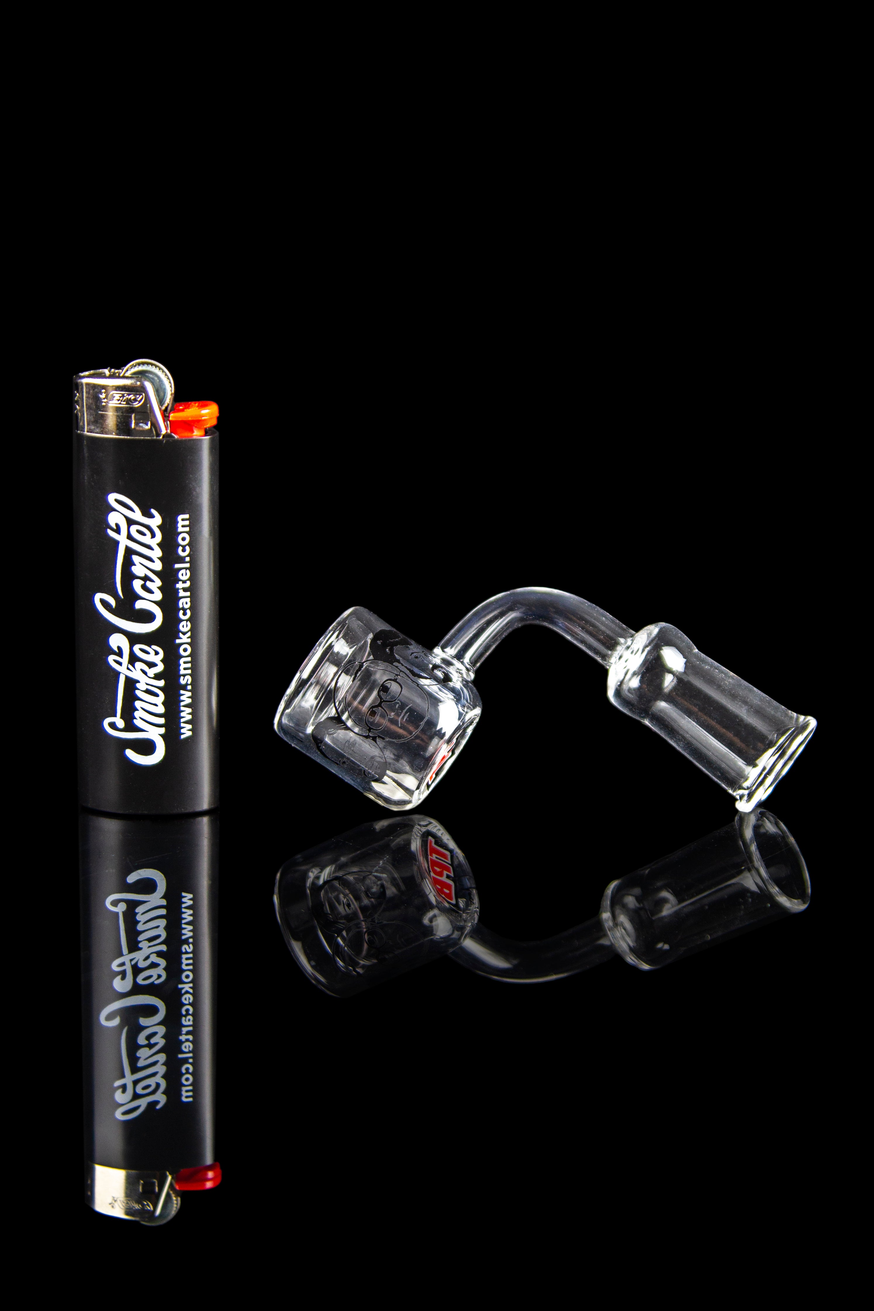 Cannabis accessories including a lighter and quartz banger displayed on a reflective black surface.