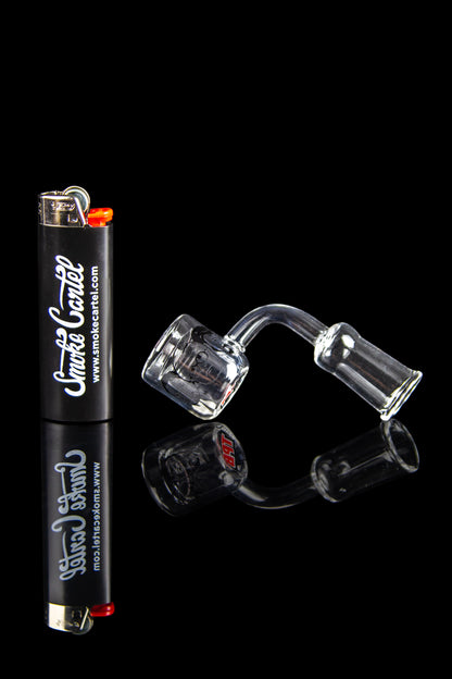 Cannabis accessories including a lighter and quartz banger displayed on a reflective black surface.