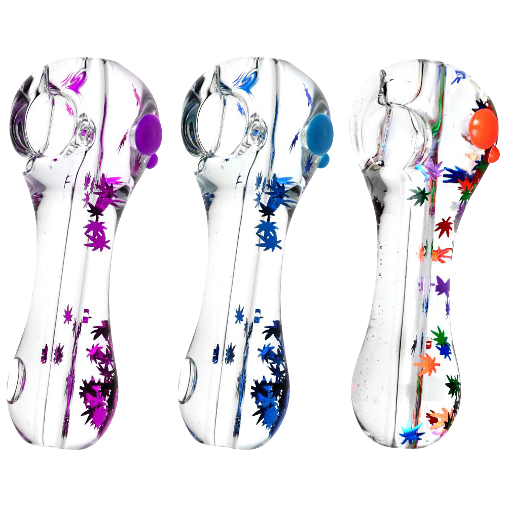 A close-up, angled view of the Freezable Glycerin Leaf Glitter Spoon Pipe, showcasing its colorful glitter accents within the clear glass.