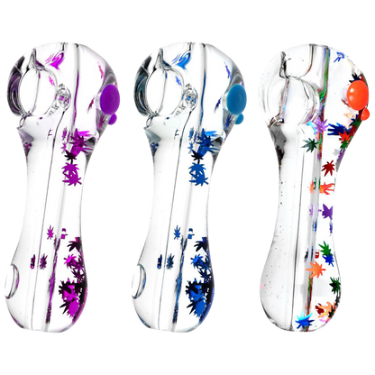 A close-up, angled view of the Freezable Glycerin Leaf Glitter Spoon Pipe, showcasing its colorful glitter accents within the clear glass.