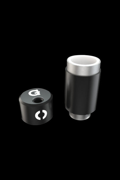 A studio shot of the G Pen Connect Replacement Tank, showing its cylindrical shape and clear glass construction from a slightly angled perspective.