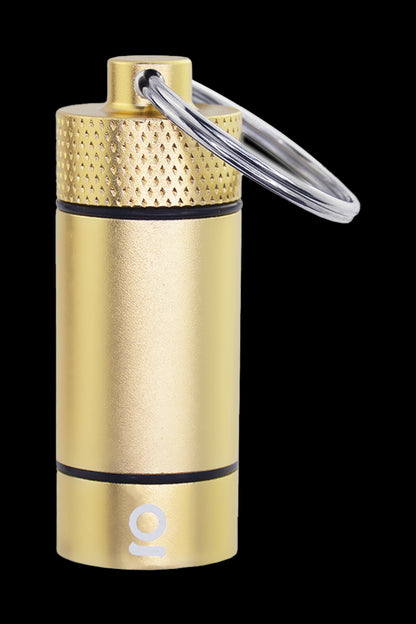 Gold cannabis oil vial with keychain attachment.
