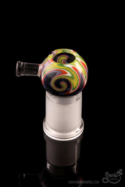 Colorful glass bubbler with swirling green and red patterns, set against a black background.