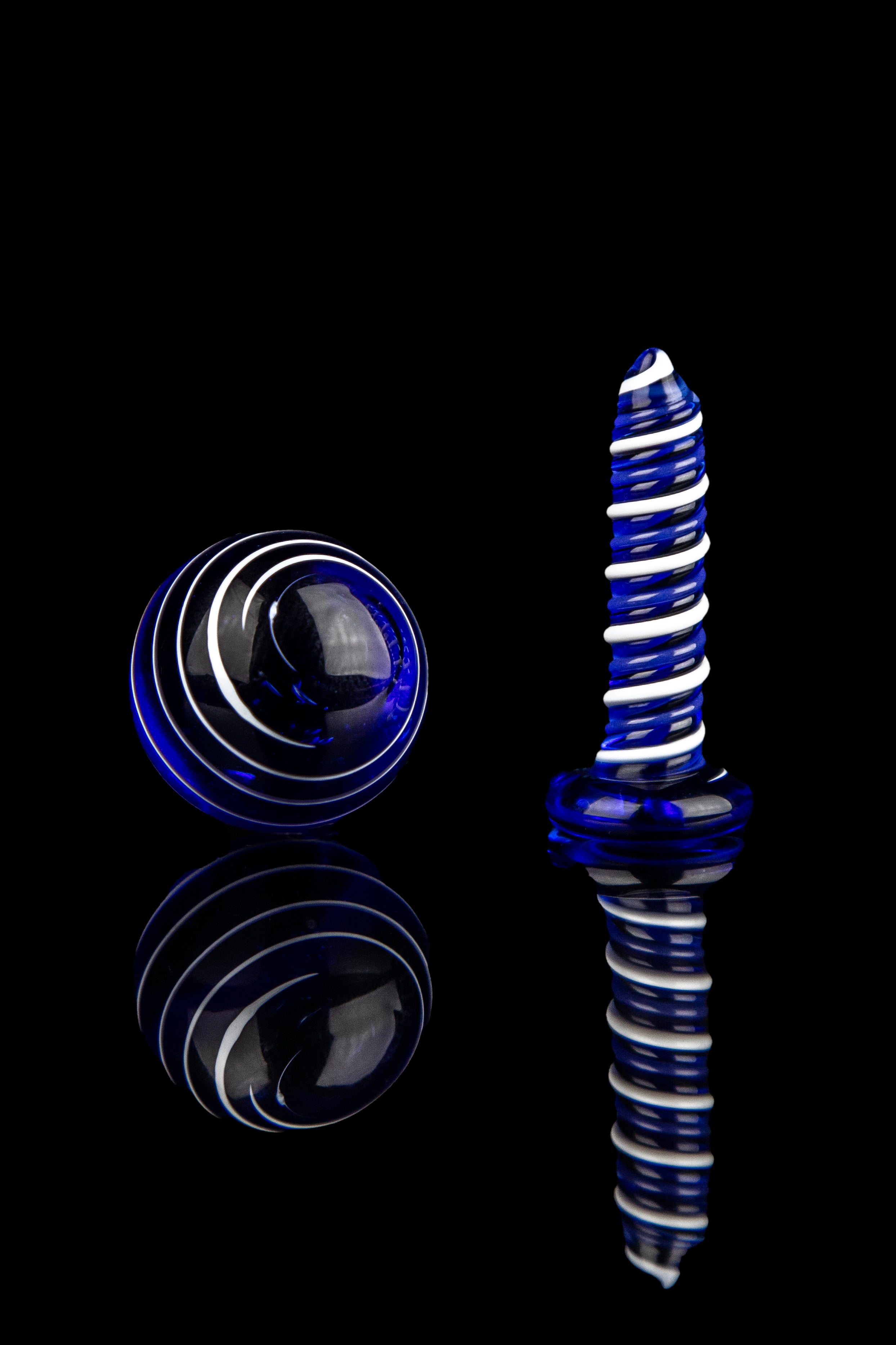 Blue glass cannabis dab rig with concentric sphere reflections.