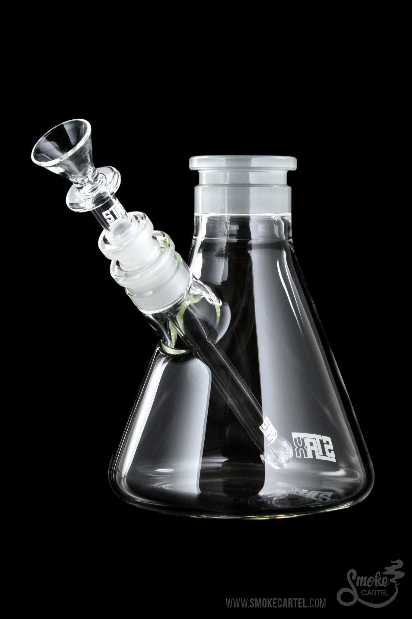 Front view of the GRAV® STAX Beaker Base, a clear glass piece with a simple, cylindrical shape on a dark background.