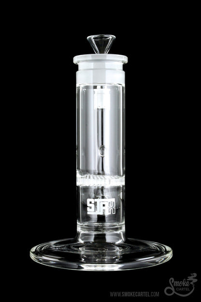 Clear glass bubbler with "STIIIZY" logo, isolated on a black background.