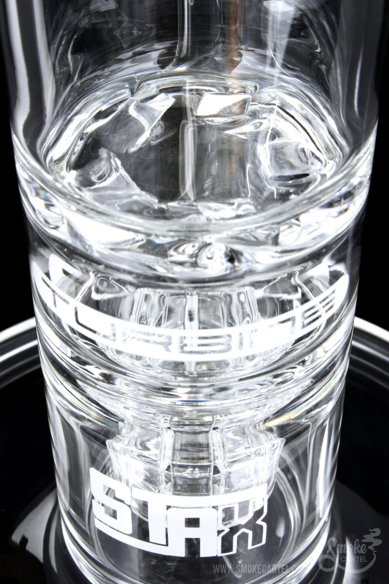 A close-up, angled view of the GRAV® STAX Flare Stemless Base with Turbine Disc, showing its clear glass construction and internal disc.