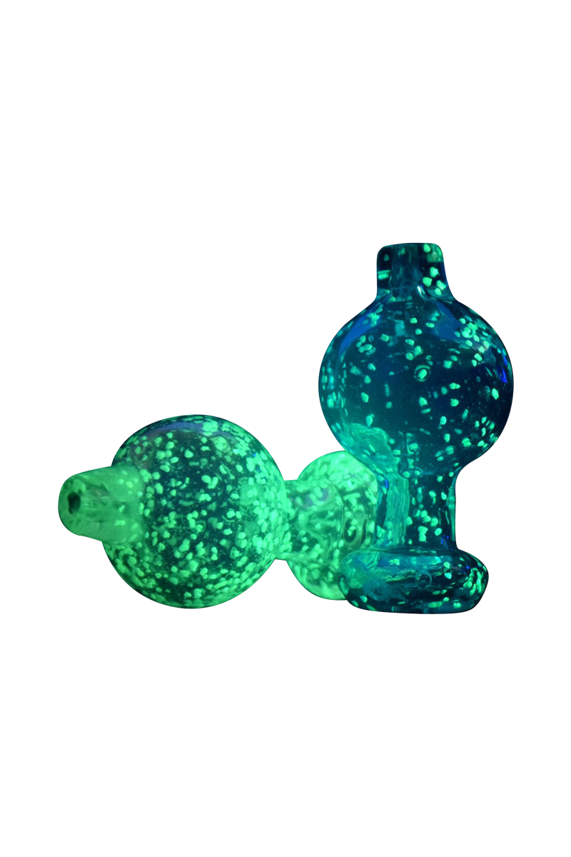 Close-up view of the Glow in the Dark Speckled Ball Carb Cap, showcasing its speckled design against a plain white background.