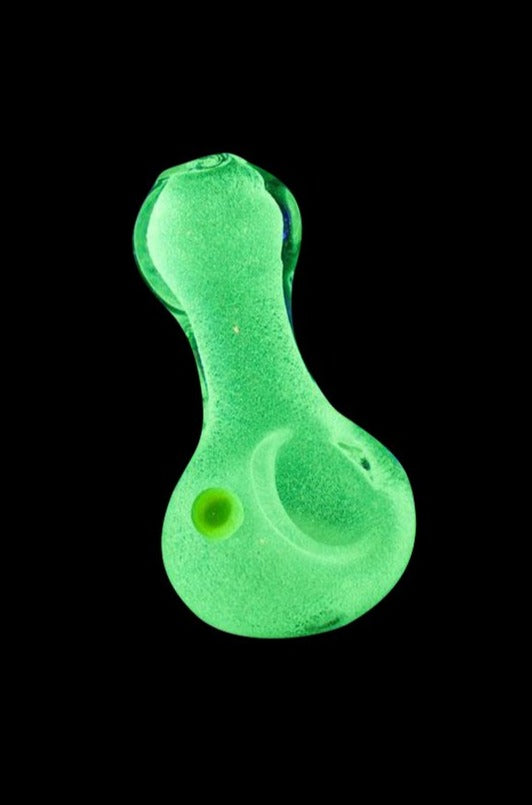 A front view of the Glow Pinch Tip Spoon Hand Pipe, featuring a green, curved design against a dark background.