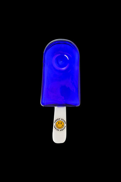 A studio shot of the Goody Popsicle Hand Pipe, resembling a blue popsicle with a smooth, rounded shape.