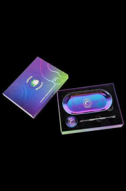 Front view of the Green Monkey Rainbow Finish Rolling Tray & Grinder Kit, showcasing its vibrant, colorful finish on a black surface.