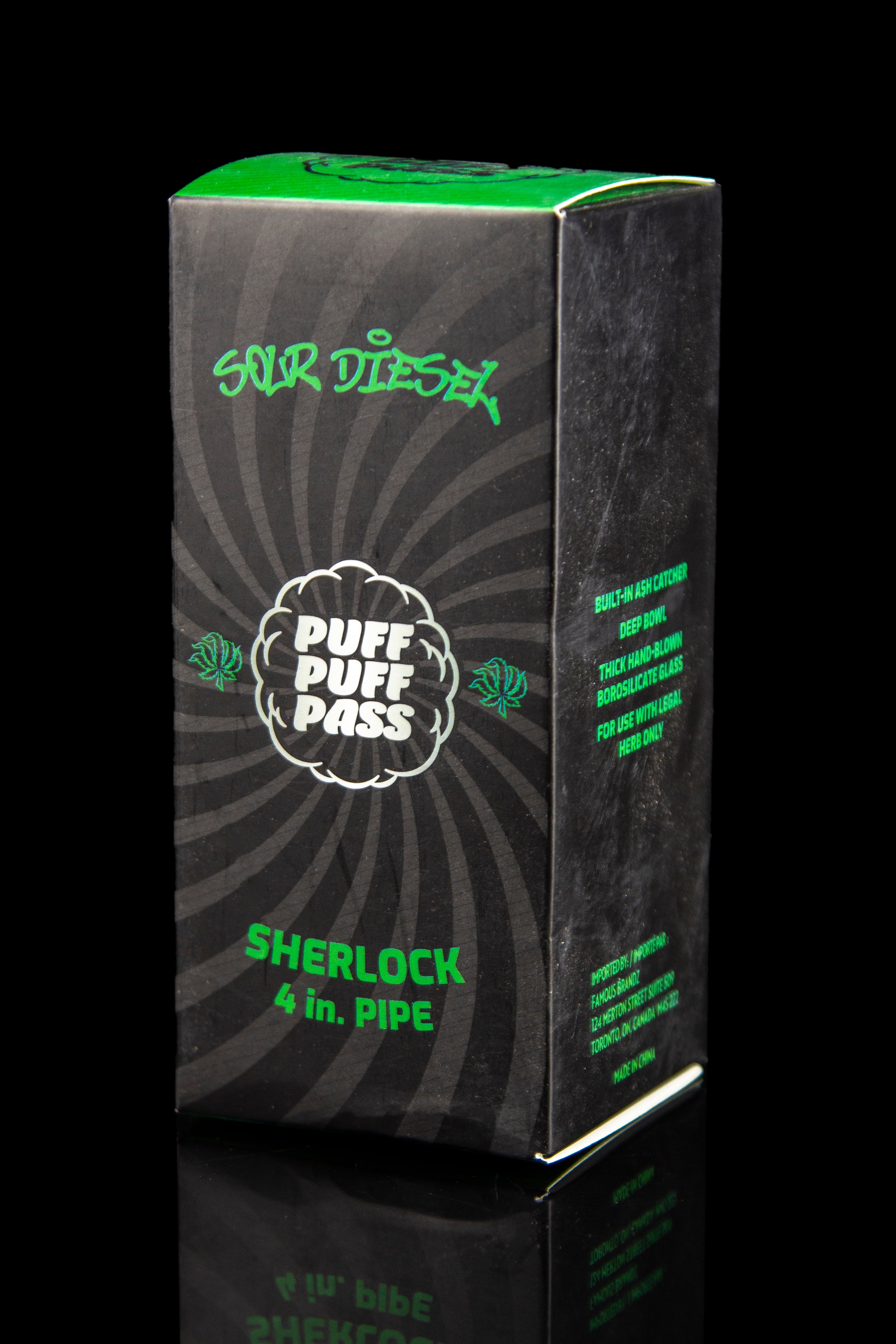 A green box for a “Sour Diesel” branded 4-inch Sherlock pipe, featuring leaf graphics and text indicating it's for legal herb use only.