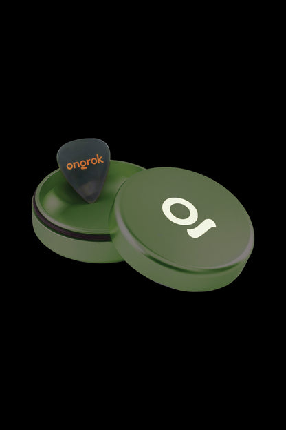 Green cannabis concentrate container with orange accent and “onrok” branding.