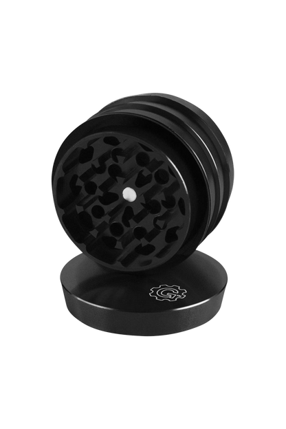 A close-up, angled view of the Pulsar 2 Aluminum Tiered 4pc Grinder, showcasing its stacked, metallic tiers and textured grinding surfaces.