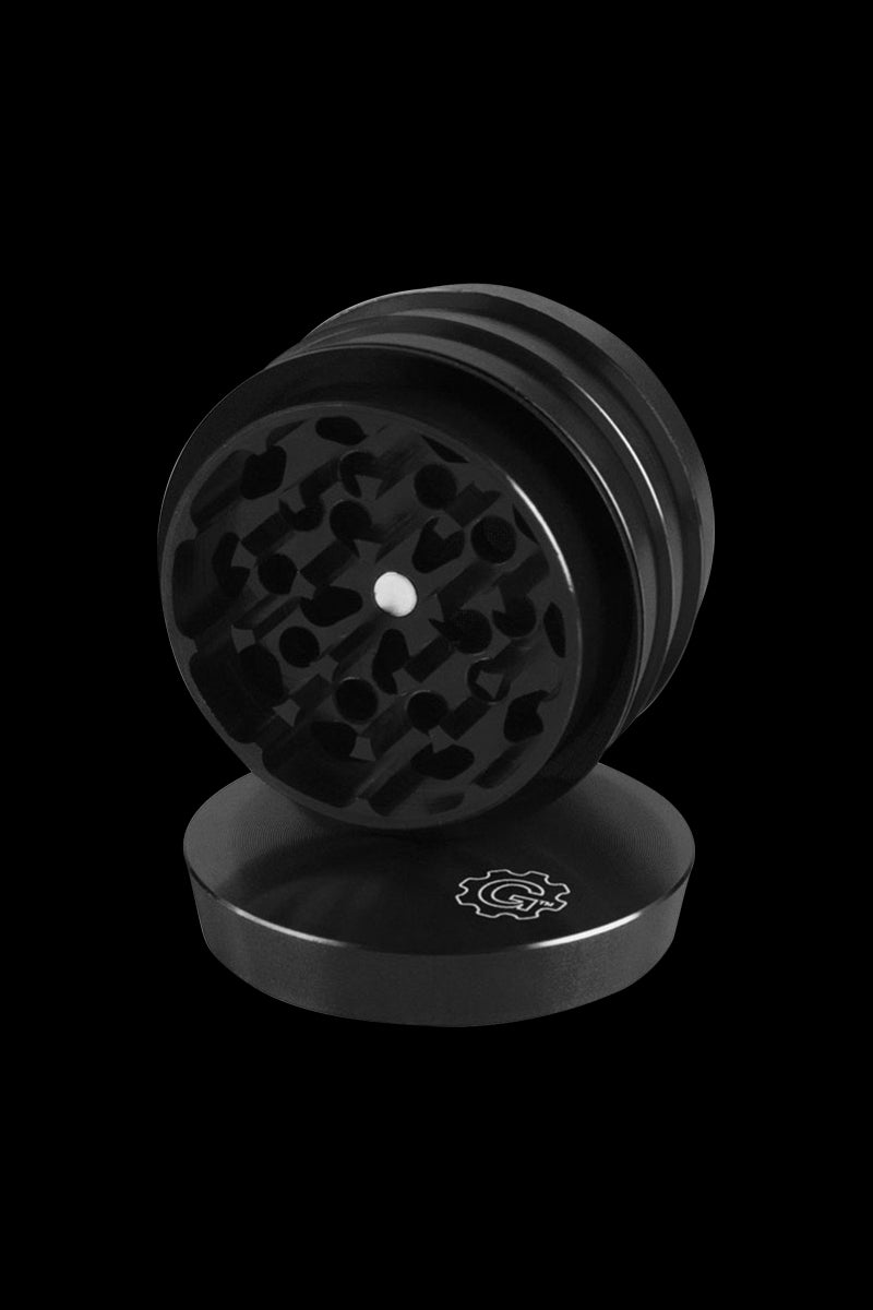 A tiered, four-piece Pulsar 2 Aluminum Grinder is shown in a close-up, angled view against a dark background.