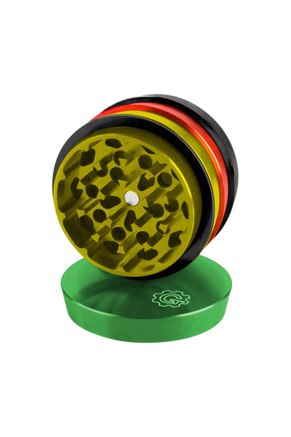 A close-up, angled view of the Pulsar 2 Aluminum Tiered 4pc Grinder, showcasing its metallic tiers and textured grinding surfaces.