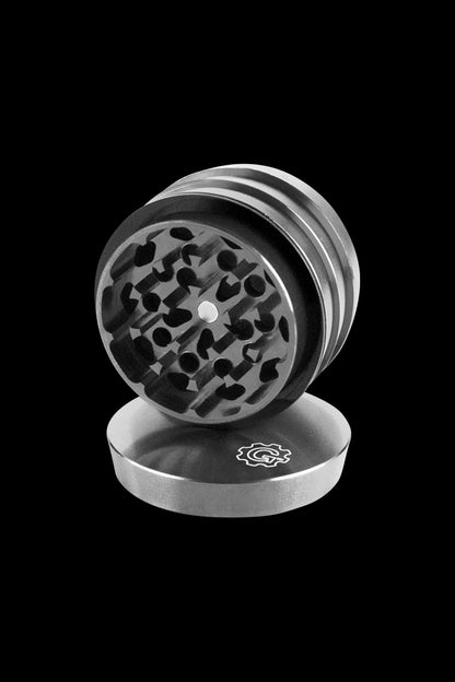 A top-down view of the open Pulsar 2 Aluminum Tiered 4pc Grinder, revealing its layered interior and metallic finish.