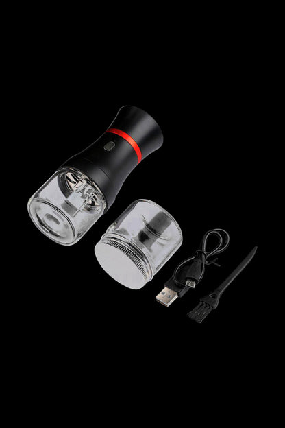 Front view of the Pulsar King Kut Electric Grinder, a sleek black device with a transparent grinding chamber and USB charging cable displayed beside it.