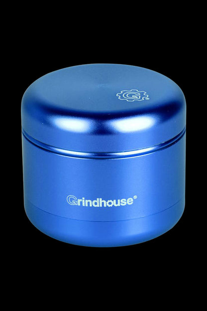 Front view of the Pulsar Matte Grinder - 4 Piece, showcasing its cylindrical shape and matte finish against a dark background.