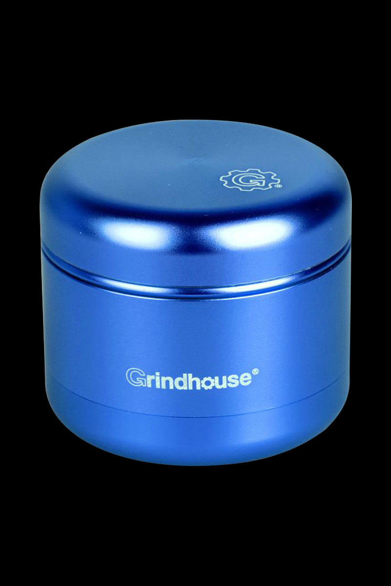 Front view of the Pulsar Matte Grinder - 4 Piece, showcasing its cylindrical shape and matte finish against a dark background.