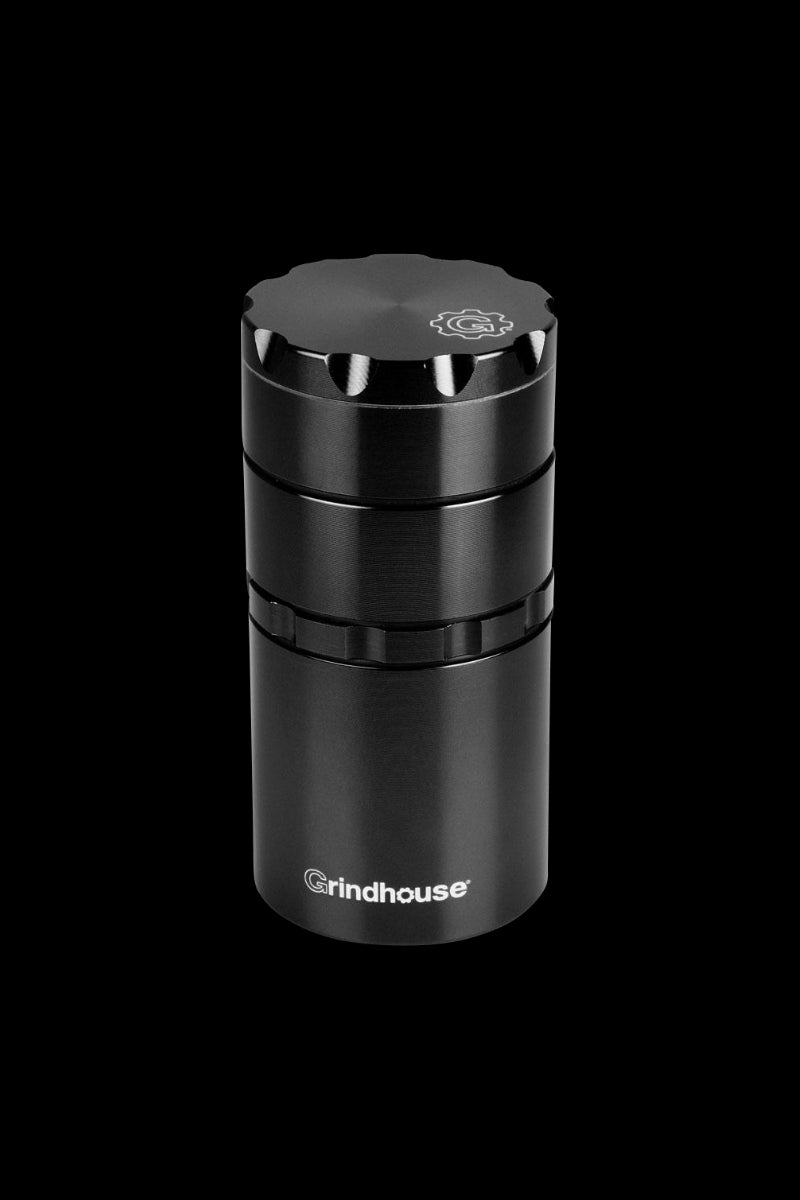 A centered, angled view of the Pulsar Metal Storage and 4-Piece Grinder, showcasing its cylindrical, metallic form.