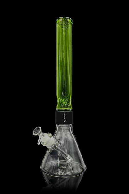A green and clear glass bong with a water chamber and downstem, isolated on a black background.