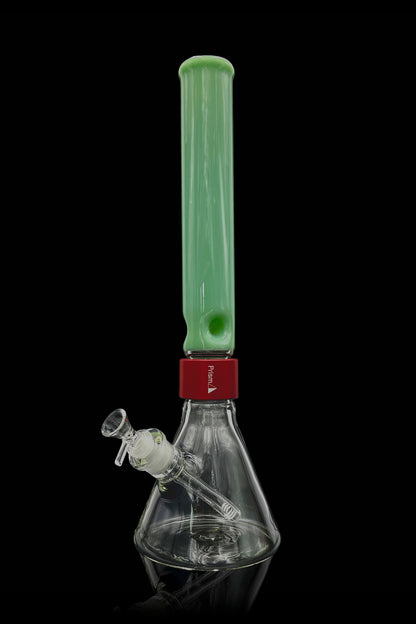 Green glass bong with a red accent and clear glass downstem, isolated on a black background.