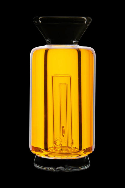 Golden glass bubbler with vertical ridges, isolated on a black background.