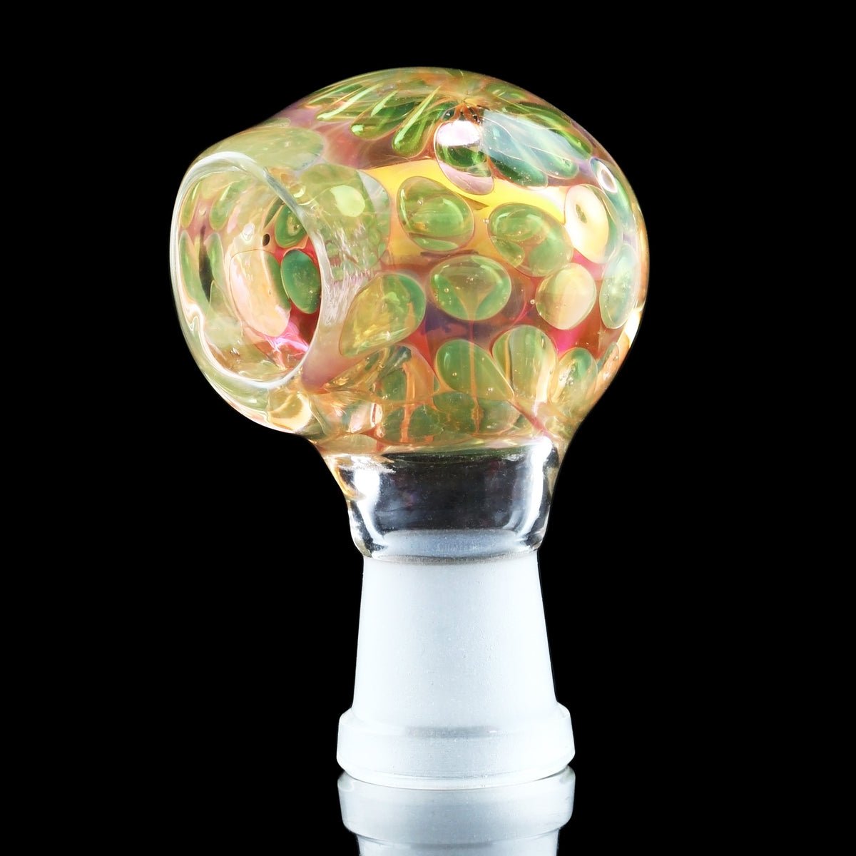 Hand-blown glass dab rig with colorful, swirling green and orange patterns.