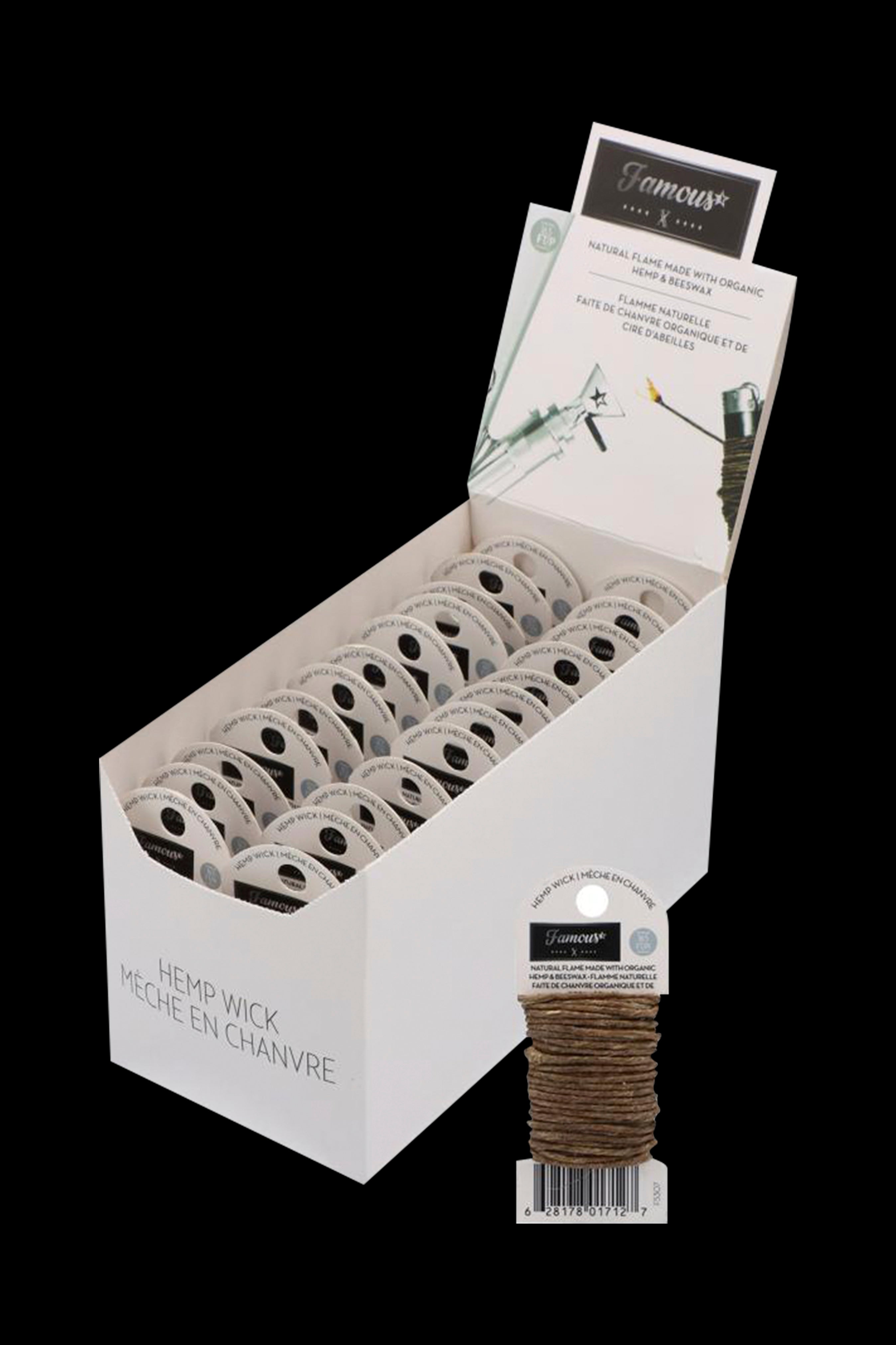 Display of organic hemp wicks in a retail setting, with packaging labeled "Famous" and "Meche en Chanvre."