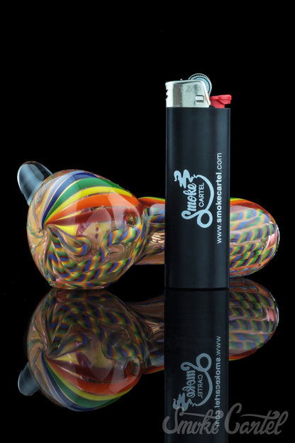 A vibrant close-up of the Heavy Cane Worked Rainbow Spoon - Rainbow Mega Pipe, displaying its colorful, swirling glasswork.