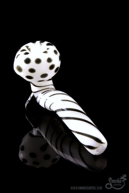 A studio shot of the Mr. Magnificent Sherlock pipe, featuring a white and black patterned design.