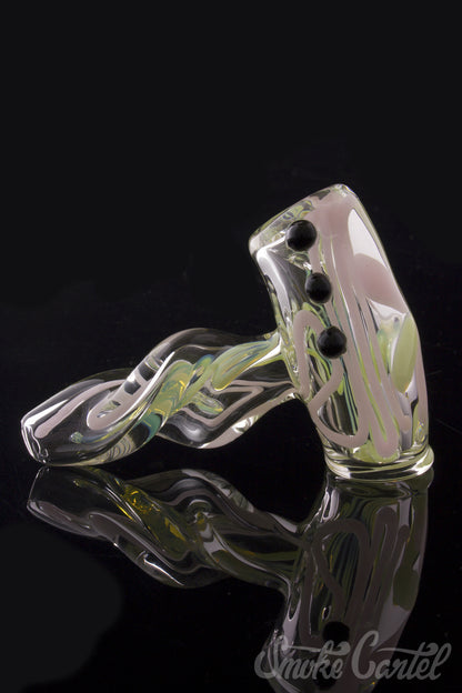 A close-up shot of the Green Slyme and Bubble Gum Inside-Out Pipe with Black Marbles, showing its swirling glass design and black marble accents.
