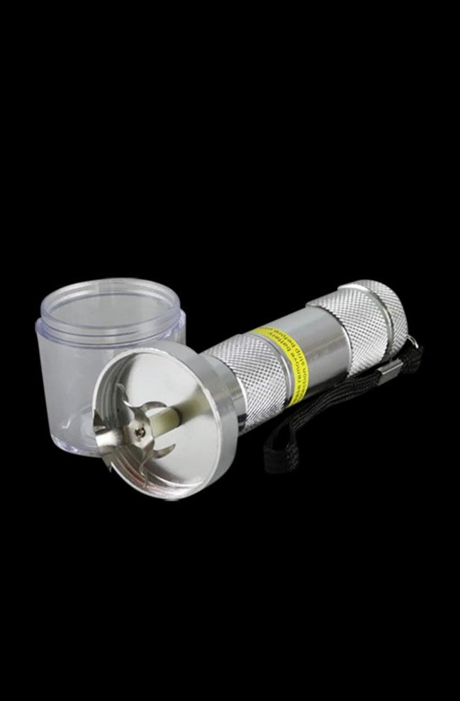 A close-up, angled view of the Handheld Electric Grinder, showcasing its metallic finish and compact design against a dark backdrop.