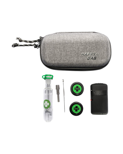 A close-up shot of The Happy Dab Kit, showing a small, black container with a transparent, cylindrical insert.