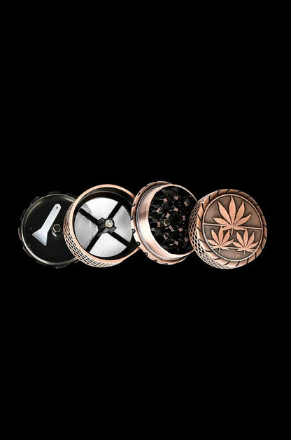 A top-down view of the 4-Piece Metal Grinder - 6 Pack, showcasing its four separate metallic pieces arranged in a circular pattern.