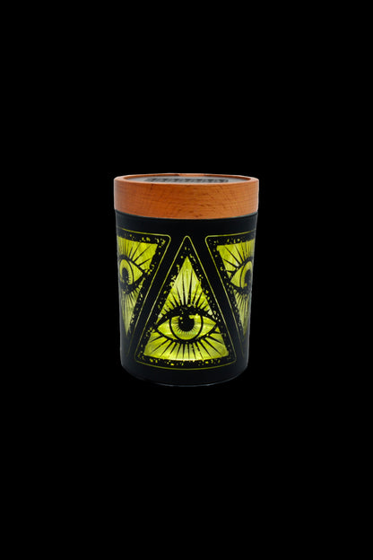 Black glass cannabis pipe with an all-seeing eye design in gold and green.