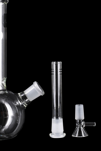 Glass water pipe components including a beaker base, downstem, and bowl, isolated on a black background.