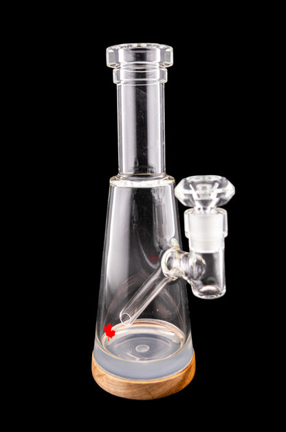 Clear glass water pipe (bubbler) with wooden base, isolated on a black background.