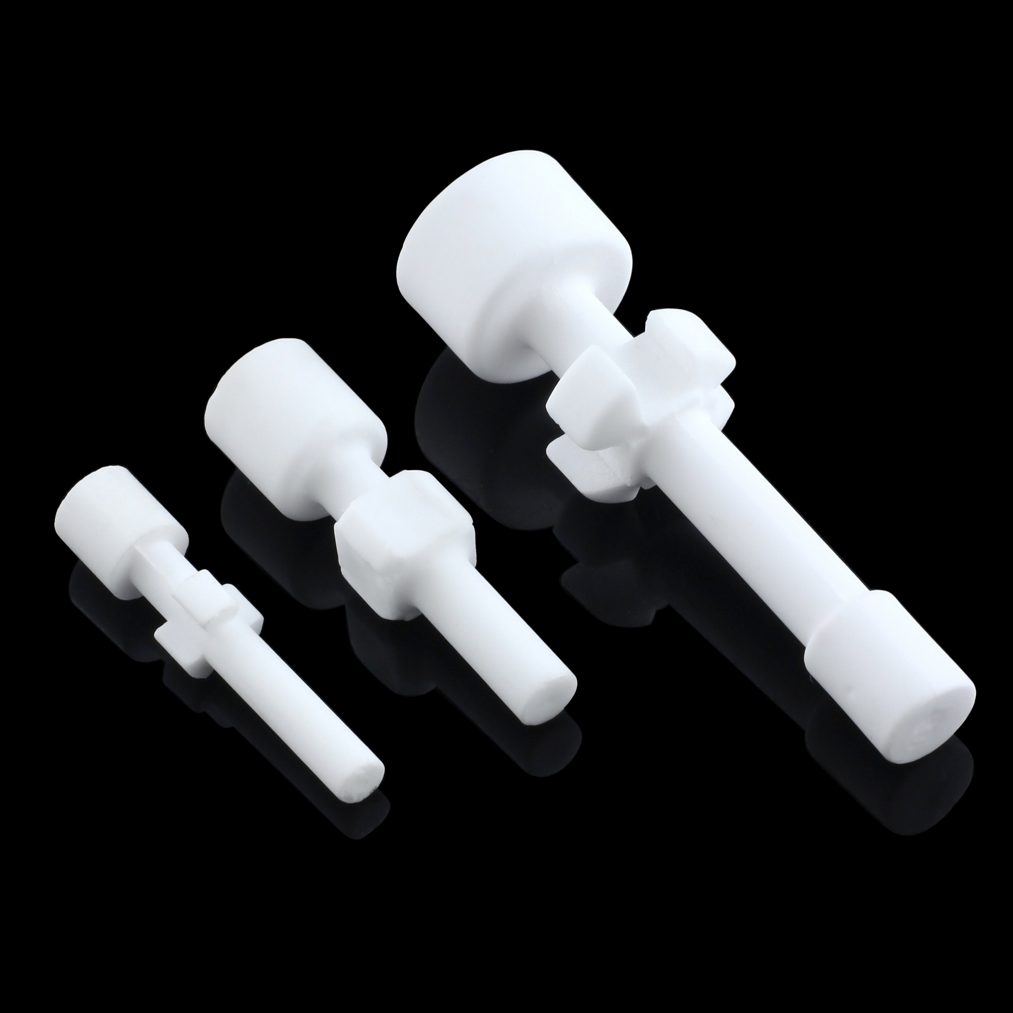 Three white ceramic or glass cannabis bowl screens of varying sizes.