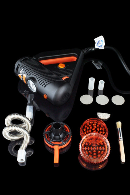 A front view of the Storz & Bickel Plenty Vaporizer with attachments, displayed against a dark backdrop.