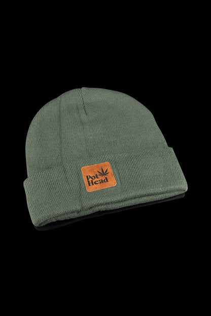 Olive green knit beanie with a “Pot Head” patch featuring a cannabis leaf.